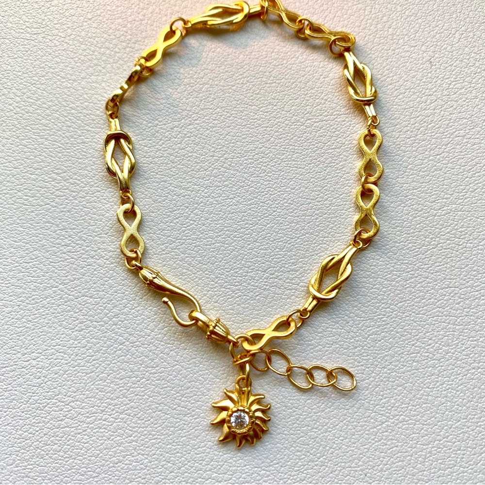 Elegant Gold Bracelet with Sun Charm